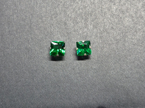 Sterling Silver Emerald Cut Stud Earrings featuring clear emerald-cut stones

